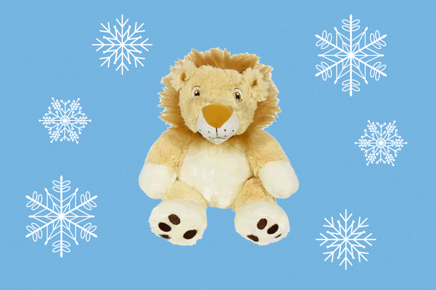 Lion staffed animal surrounded by snowflakes 